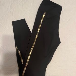 Women’s Asic’s running leggings with gold detailing